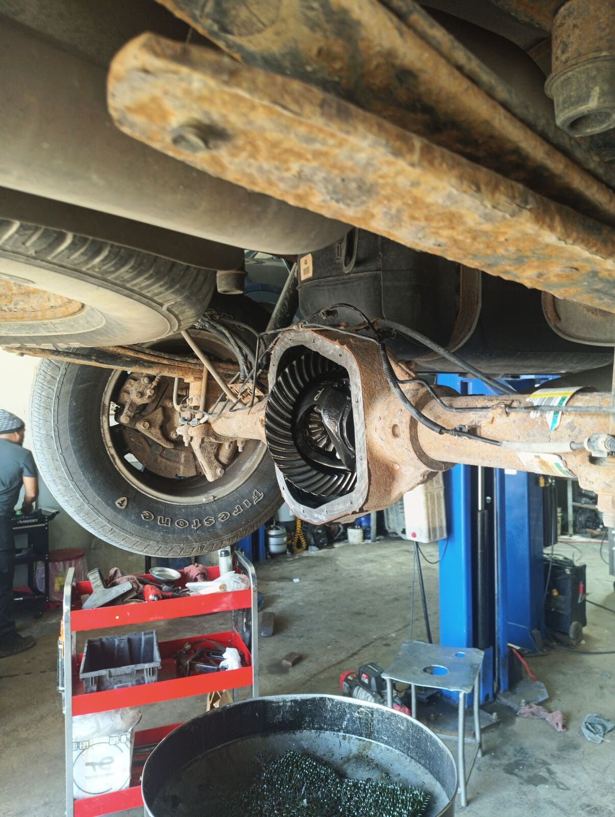 Underside of a truck with the rear axle cover removed